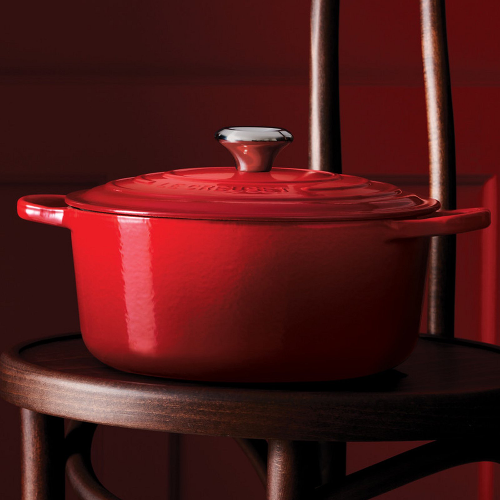 1 photo of red enameled Le Creuset cast iron pot.